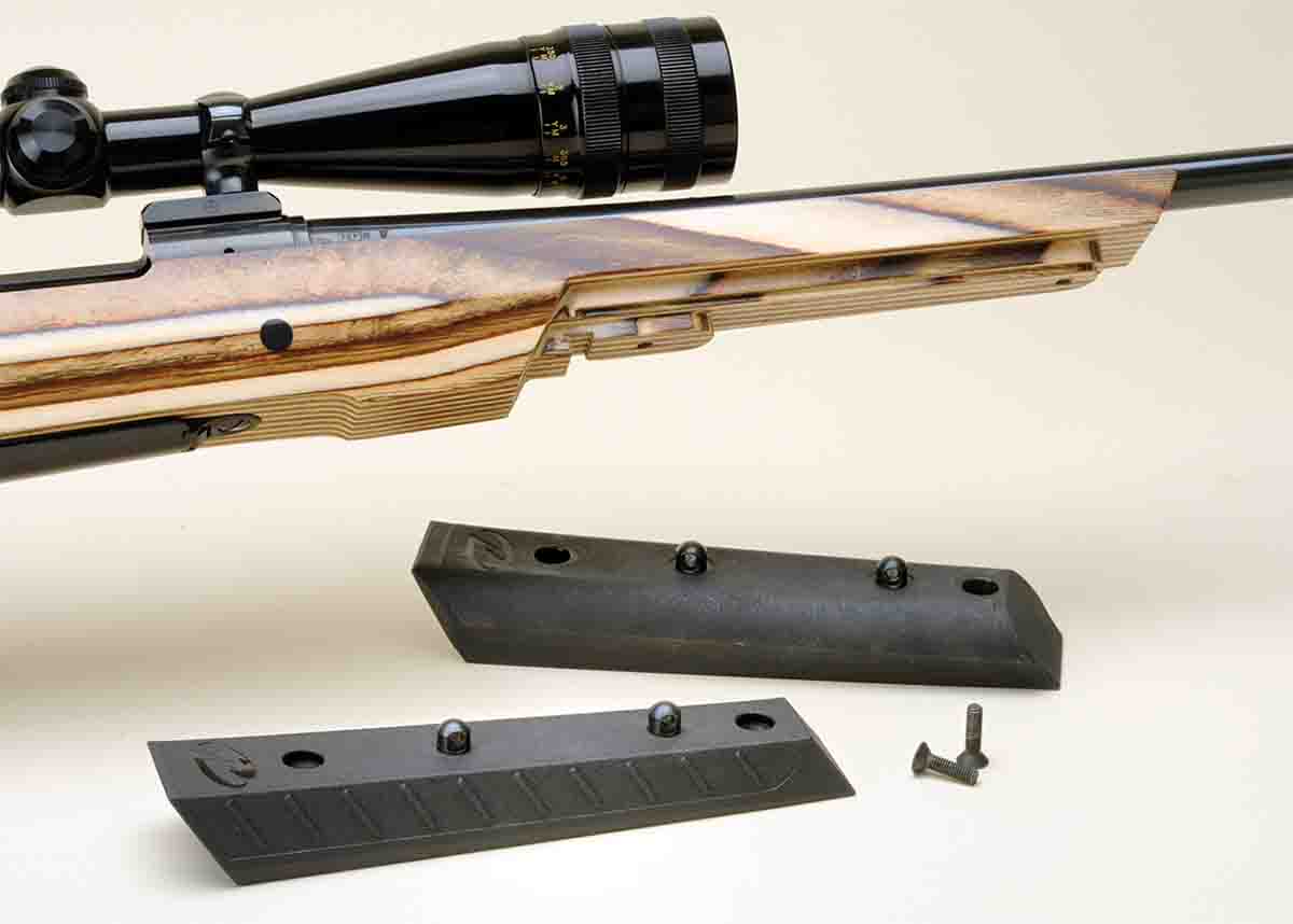 The forearm insert is interchangeable from sporter taper (bottom) to a wider version for varmint shooting.